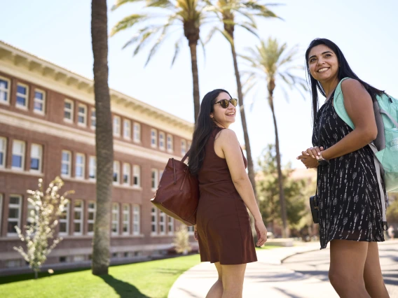 students walking on campus east of Old Main