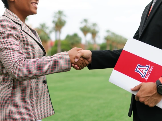 Students preparing for their future careers on campus through networking/shaking hands.