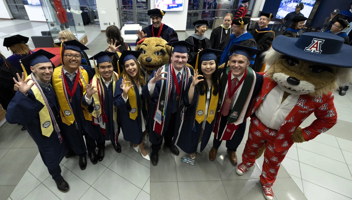 Senior-Awardees-with-Wilbur-and-Wilma-mascots-before-ceremony-in-Lowell-Stevens