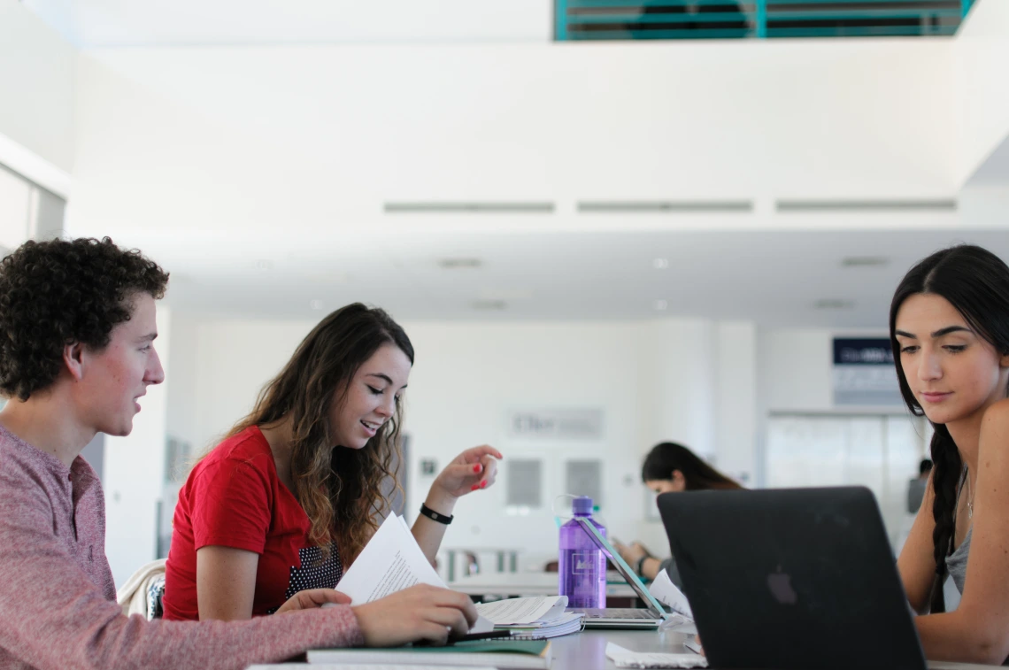 students with a laptop